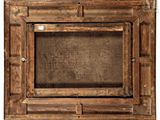 a picture of an old wooden picture frame on the wall