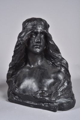 black and white photograph of a busturine of a woman wearing a headdress