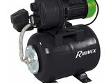 a black compressor pump with a green hose attached to it