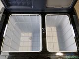two coolers that are open on the floor