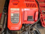 an image of a red corded drill and a red battery
