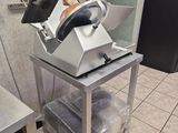 a machine that is sitting on a cart in the kitchen