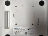 a close up of a white electronic device on a table