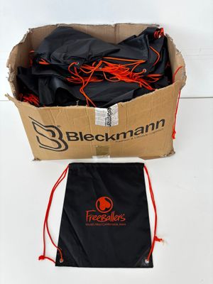 a black bag with orange string and a black bag with red string
