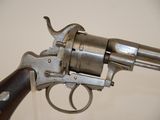 a close up of a gun on display in a museum