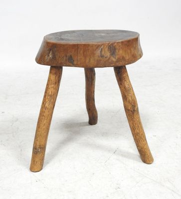 an image of a wooden stool with two legs on a white background