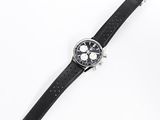 an image of a watch on a black leather strap on a white surface
