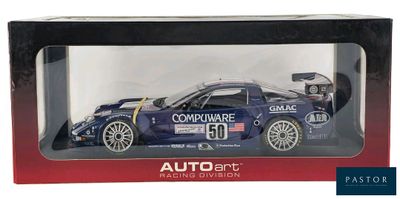 the box is open to show a model of a race car