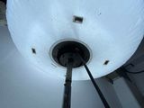 a lamp that is on a pole in a room
