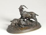 bronze sculpture of a goat and a dog on a rock