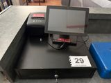 an image of a cash register with a tablet on it