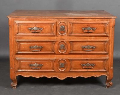 an antique chest of drawers with a wooden top and brass handles