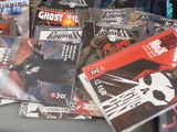 a lot of comic books sitting on a table