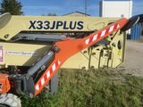 a picture of a crane that is sitting in the grass