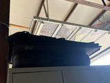 a stack of luggage sitting on top of a cabinet
