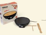 a box of food on the table next to a crepe maker