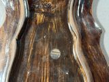 a picture of a wooden wall clock on the wall