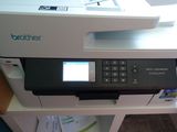 a printer that is sitting on top of a desk