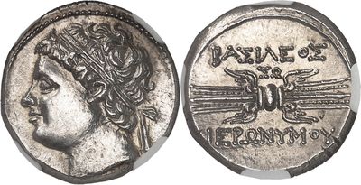 a silver coin with an image of a woman on it