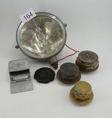 an image of a group of old metal objects on a white surface