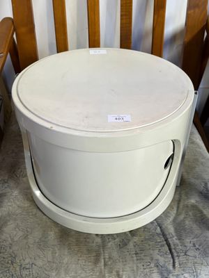 a white box sitting on top of a wooden chair