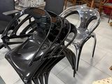 many chairs and tables in a room with a lot of furniture