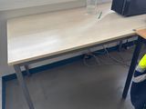 a desk with a computer and a monitor on it