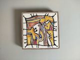 a picture of a tile with a painting on it