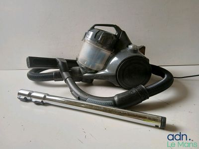 a vacuum and a tool sitting on a table