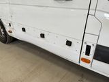 a white van that is parked in a garage