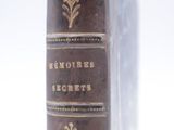 an old book that is sitting on a table