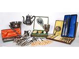 many different types of silverware and silverware on the table