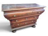 a wooden chest of drawers on wheels on a white background