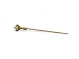 an image of a gold stick with a flower on top of it