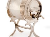 silver plated wine barrel on stand on white background