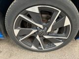 a close up of a tire on a blue car