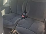 two seats in the back of a car that are empty