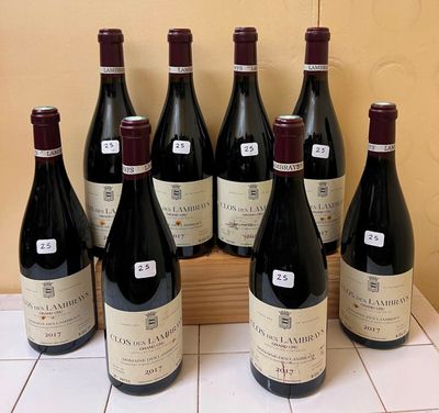 six bottles of wine are lined up in a row on a counter
