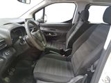 the interior of a small car with black seats and a steering wheel
