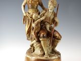 an image of a statue of a man and two children