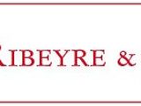 a white sign with the words baron ruevre and associates on it