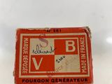 a small box with a red and white label on it