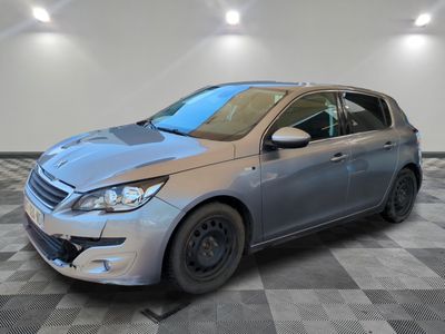 a picture of a silver car parked in a garage