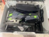 a box with tools in it sitting on the floor