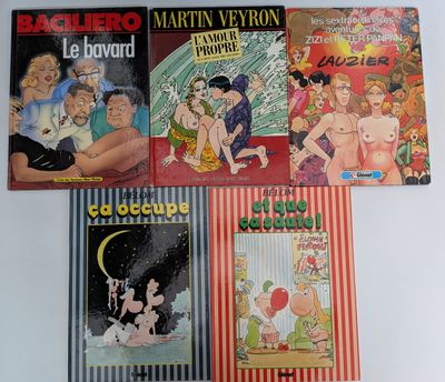 Plusieurs albums de BD sont alignés sur une surface blanche