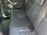 the back seats of a car are empty and the seats are empty
