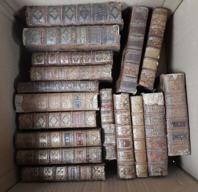 many old books in a box on the floor