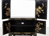 an image of a black and gold decorated cabinet