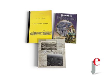 three books that are sitting on top of a table