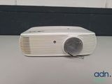 a close up of a white radio sitting on top of a table